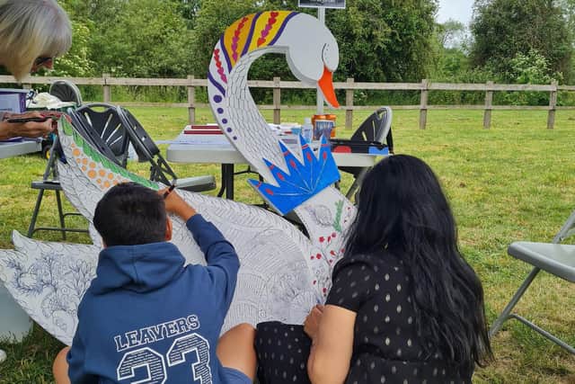 Helping decorate one of the swans for the Buckingham Swan Trail