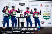 (L-R) Simon Pagenaud, Colin Braun, Tom Blomqvist and Helio Castroneves, drivers of The #60 Meyer Shank Racing w/ Curb-Agajanian Acura ARX-06 celebrate in victory lane after winning the Rolex 24 at Daytona International Speedway on January 29, 2023 in Daytona Beach, Florida. (Photo by James Gilbert/Getty Images)
