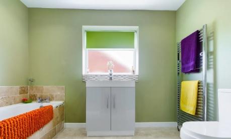 A first look at the family bathroom which contains a shower as well as a bath and heated towel rail.