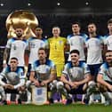 England players pose for a squad photo ahead of their Group B clash with Wales - with a 3-0 victory in the game setting up a last-16 tie with Senegal. (Photo by PAUL ELLIS/AFP via Getty Images)