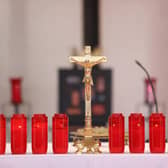 Ten candles are lit at the altar, photo from Liam McBurney PA Wire/PA Images