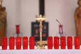 Ten candles are lit at the altar, photo from Liam McBurney PA Wire/PA Images