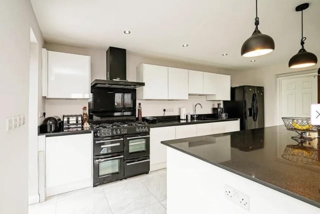 The kitchen has Tiled underfloor heating, two double glazed windows to rear and side aspects, bi-fold doors to rear garden, with built-in storage cupboards, freestanding double cooker gas stove and oven, cooker hood, sink with drainer, fitted kitchen wall and base units, underfloor heating.