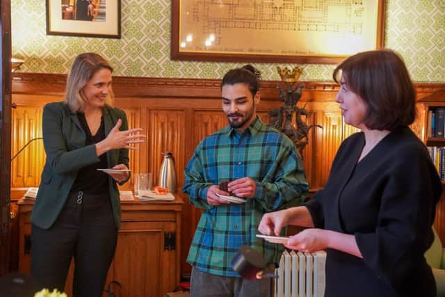 Laura Kyrke-Smith MP, Dylan Bachelet and Lucy Powell MP try some Parliamentary cakes