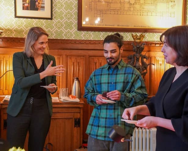 Laura Kyrke-Smith MP, Dylan Bachelet and Lucy Powell MP try some Parliamentary cakes