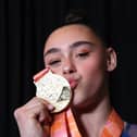LJessica Gadirova of Great Britain kisses their gold medal following the medal ceremony for Woman's Floor Final at the 2022 Gymnastics World Championships (Photo by Laurence Griffiths/Getty Images)