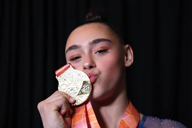 LJessica Gadirova of Great Britain kisses their gold medal following the medal ceremony for Woman's Floor Final at the 2022 Gymnastics World Championships (Photo by Laurence Griffiths/Getty Images)