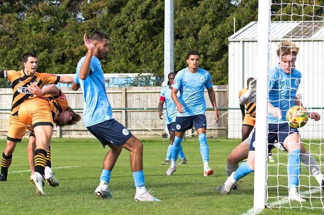 Max Cavana (left) ducks in to head the opening goal at Dunstable. Photo by Mike Snell.