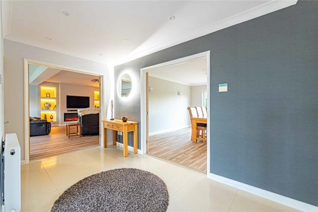 Walking in, the bright and airy entrance hall welcomes you into the house.