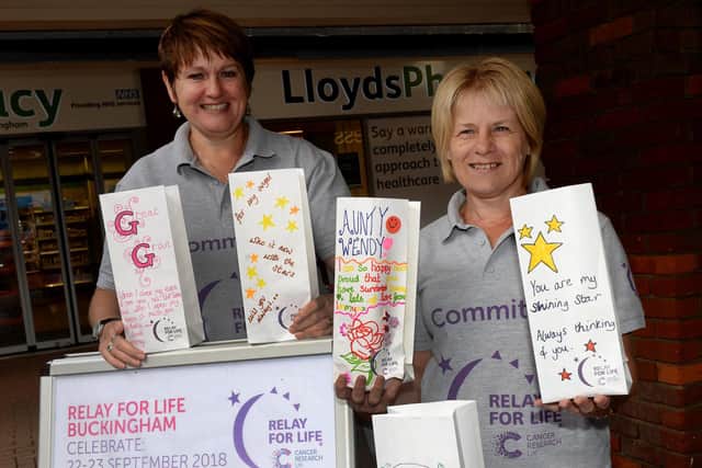 Volunteers Cath Stroud and Linda Woodham sell Candle of Hope bags at the 2018 Cancer Research UK Relay for Life in Buckingham