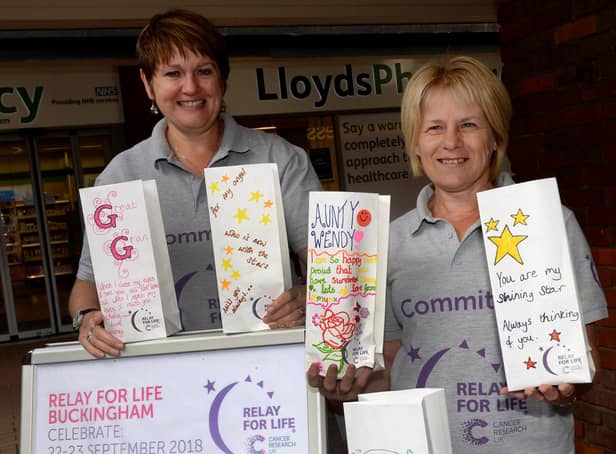 Volunteers Cath Stroud and Linda Woodham sell Candle of Hope bags at the 2018 Cancer Research UK Relay for Life in Buckingham