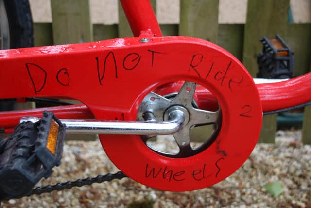 The message scrawled on one of the returned trikes