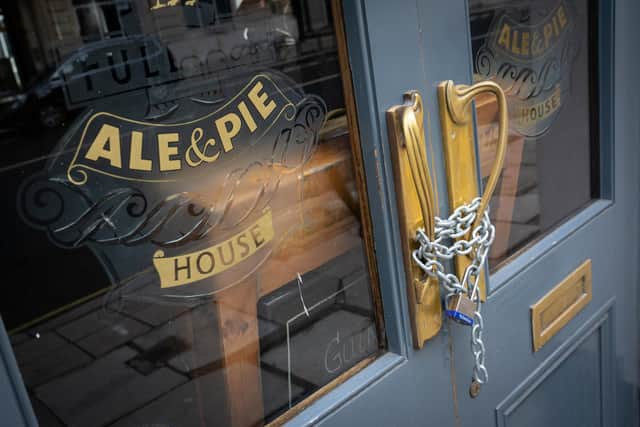 Chains securing the doors of a closed pub