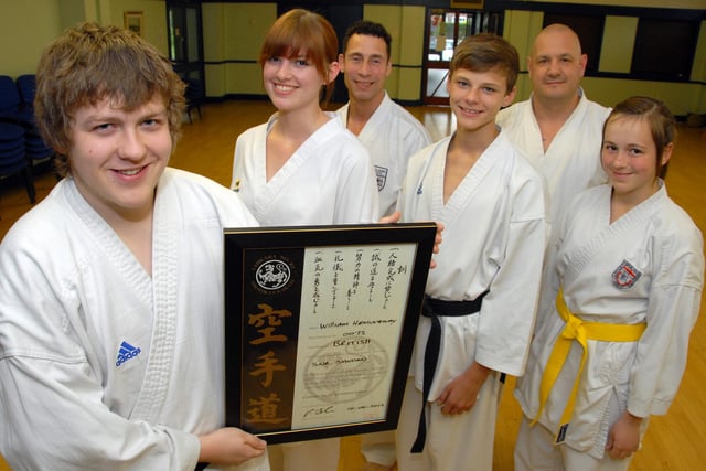 Three members of Ollerton's Shotokan Karate Club recently gained their Black Belts after a grading course. Pictured from left are; William Hemingway Senior Black Belt 1st Dan, Kathryn Faulkner Senior Black Belt 2nd Dan, Chief Instructor, Sensei Paul Jalam, Edward Faulkner Senior Black Belt 1st Dan, Senior Instructor Deano Woodhouse and Rose Hemingway who double graded both Red and Yellow belts.