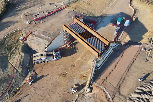 The bridge is craned into place