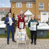 Aylesbury Mayor Tim Dixon, centre, with Marc Woolfe, head of sales at Barratt David Wilson North Thames, and Aylesbury Foodbank volunteer Sherrilyn Bateman