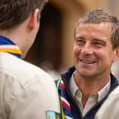 Bear Grylls talking with volunteers