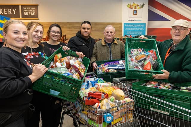 Charity partners collect unsold food from Aldi on Christmas Eve