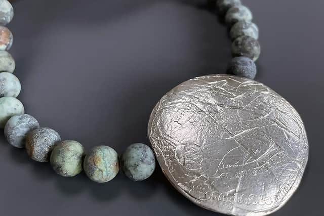 Cropped fragment and turquoise necklace by Kate Wilkinson