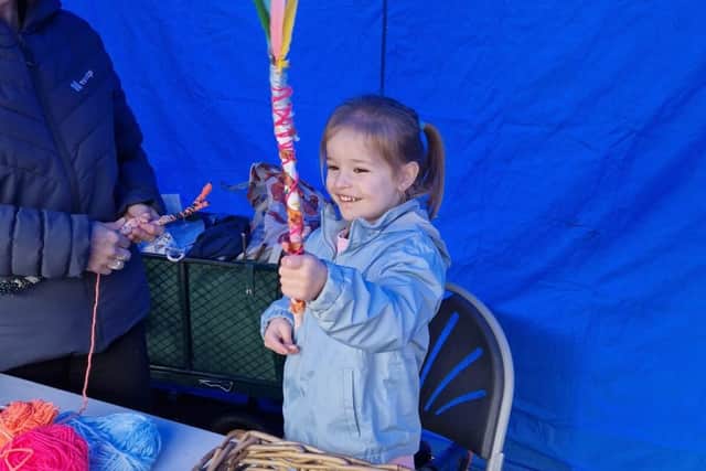 Young Girls Making Magic Wands From Recycled Materials at Fair