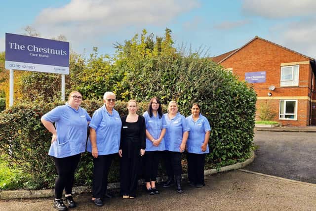 The Chestnuts Care Home Manager Laura Williams with members of her team outside the home on Lavric Road in Aylesbury.