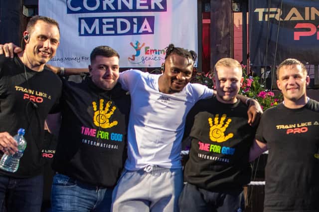 Linus Udofia (centre, in white) - pictured last year at a Pegasus charity event - will be fighting for the British Middleweight title on Friday, May 13