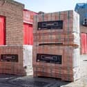 The college will receive a donation of bricks and branded merchandise