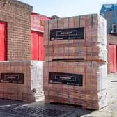 The college will receive a donation of bricks and branded merchandise