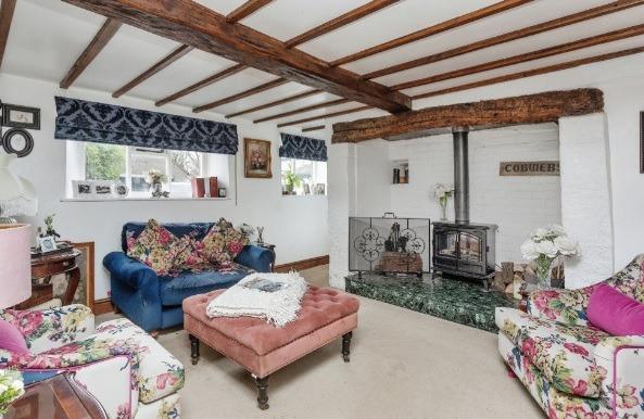 The family home which has a inglenook style fireplace with a wood burning stove.