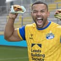 First men’s team captain of the Leeds Rhinos, Kruise Leeming, ‘try-s and tastes’ new Deliveroo x Hooyah Burgers exclusive Leeds Rhinos burger ahead of its launch on National Burger Day, August. 25 (photo: Doug Jackson/PinPep)