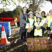 Pupils with Michael Green of Barratt David Wilson Homes and play co-ordinator Louise Taffe