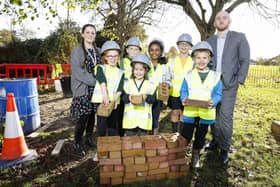 Pupils with Michael Green of Barratt David Wilson Homes and play co-ordinator Louise Taffe