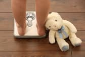 Picture posed by model. An 11 year old girl using a set of weighing scales. Photo from Chris Radburn/PA Images