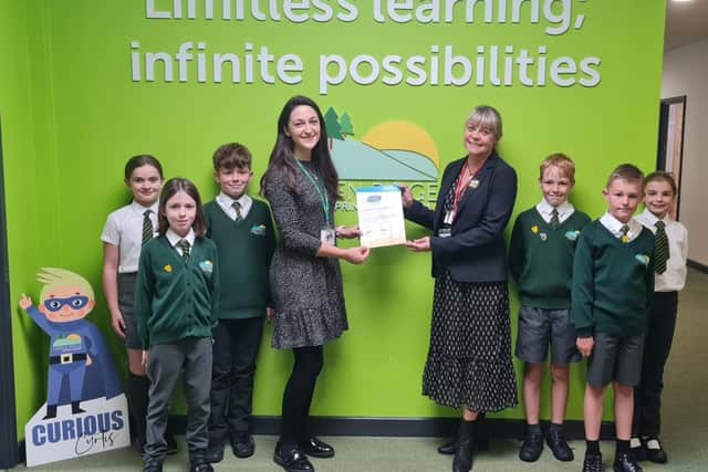 Students from Green Ridge Primary Academy holding their Modeshift STARS Certificate of Accreditation