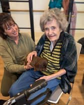 Resident Anne with Jane and puppy Hank