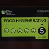 A Food Standards Agency rating sticker on the window of a restaurant