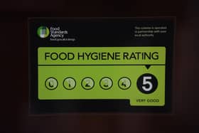 A Food Standards Agency rating sticker on the window of a restaurant