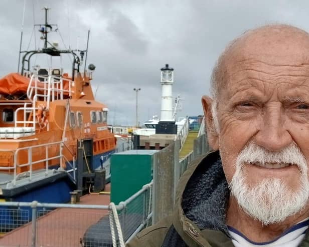 Derek Adams on his walk as the 82-year-old became the first person to complete a 4,250 mile trek along Britain's coast stopping at every lifeboat station on the way. Photo: Susan Adams/SWNS