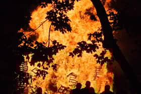 Residents watch the huge bonfire
