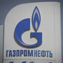 The logo of Russia's energy giant Gazprom is pictured at one of its petrol stations in Moscow (Photo by NATALIA KOLESNIKOVA/AFP via Getty Images)