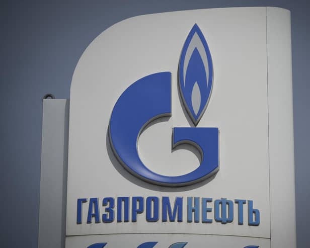 The logo of Russia's energy giant Gazprom is pictured at one of its petrol stations in Moscow (Photo by NATALIA KOLESNIKOVA/AFP via Getty Images)