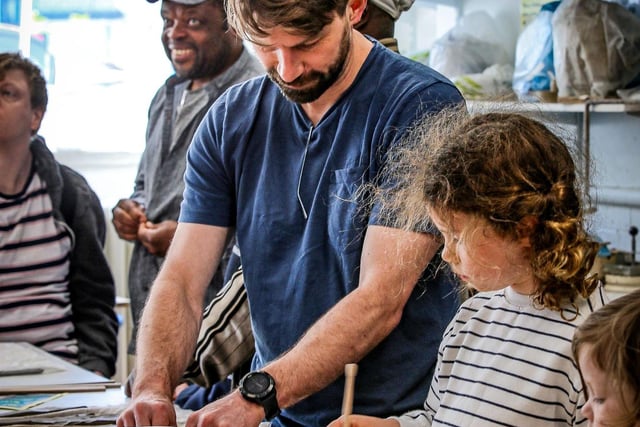 Members of the Public getting involved in a pottery challenge at the QPAC Open Day, May 2025