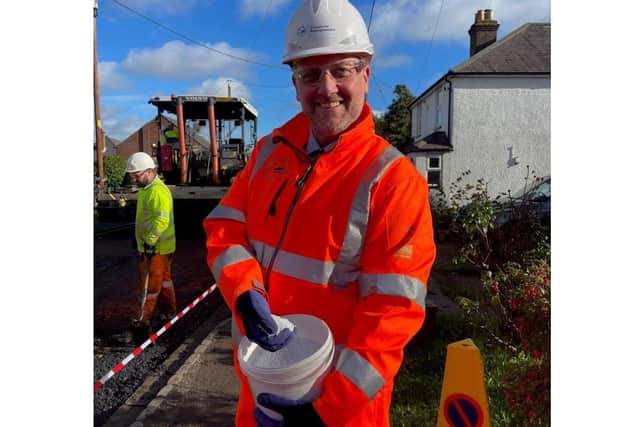 Steven Broadbent, Cabinet Member for Transport, with the pellets made from recycled plastic