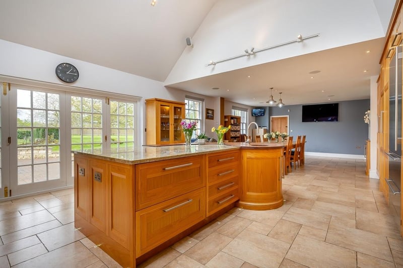 The kitchen is bright and airy with views across the garden