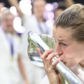 Ellen kisses the trophy (Photo by JUSTIN TALLIS/AFP via Getty Images)