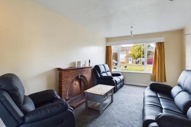 The living room consists of a window to the front aspect, brick built fireplace, carpet laid to floor, radiator, light fittings to ceiling and double doors leading into the dining room. There is space for a sofa suite and other furniture.