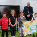 Reception and Year 1 children present their work to Bishop David