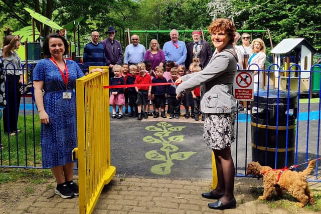 The mayor cuts the ribbon to officially open the park