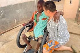 Tom Yendell with with De-Graft and his new wheelchair