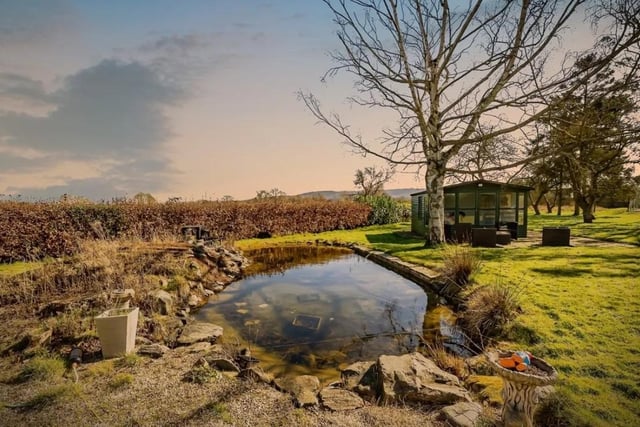 Connells says the garden wraps around the property and is mainly laid to lawn with the rear garden again planted with mature shrubs.